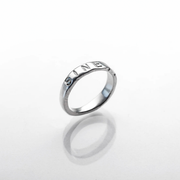 Silver ring with 'Infinity' engraving on a white background