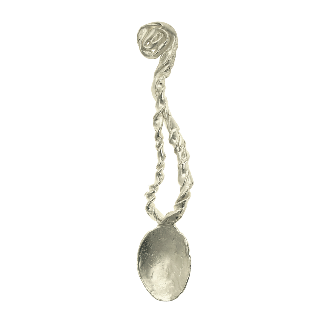 A handcrafted, silver spoon with a twisted design, evoking a sense of ancient magic and myth.