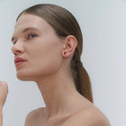 Silver stud earrings, featuring Baltic amber by Adele Notes.