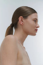 Silver stud earrings, featuring Baltic amber by Adele Notes.