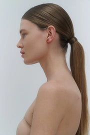 Silver stud earrings, featuring Baltic amber by Adele Notes.