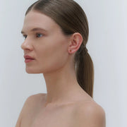 Silver stud earrings, featuring Baltic amber by Adele Notes.
