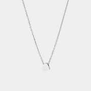 A silver necklace with a chain length of 40 cm, featuring a heart-shaped pendant made of silver.