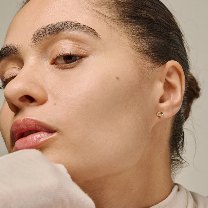 Close-up of a woman's face with a neutral background