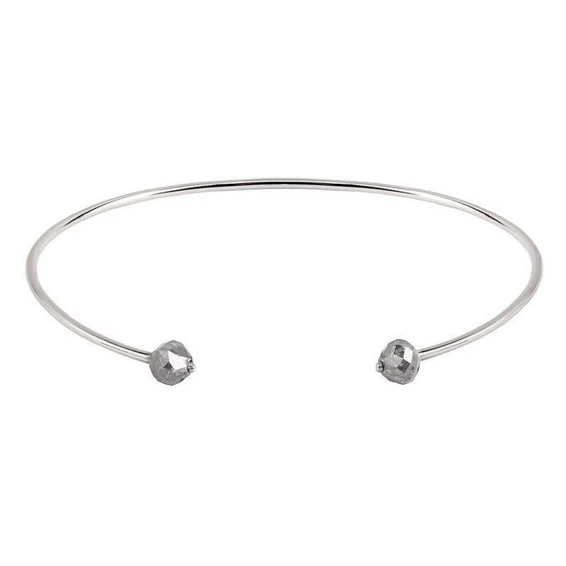 A thin white gold open cuff bangle bracelet with two small faceted grey diamonds at the ends, shown on a plain white background.