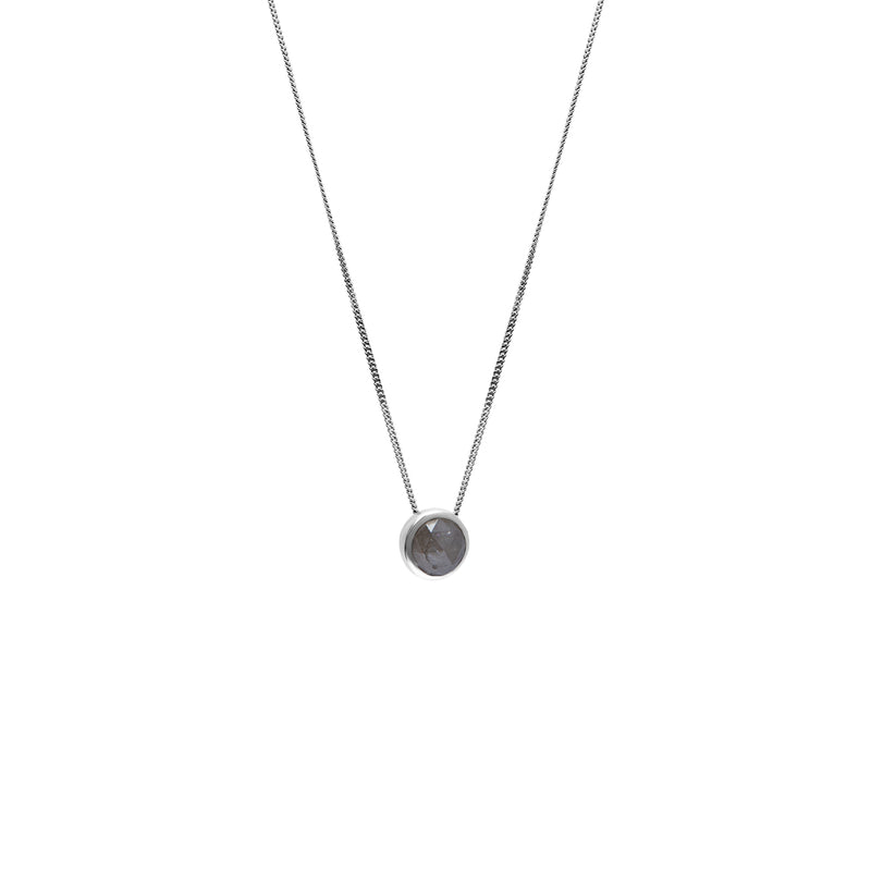 A delicate gold chain necklace with a small bezel-set rose-cut grey diamond pendant, shown against a plain white background.