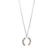 White gold necklace with a faceted grey diamonds pendant on a white background.