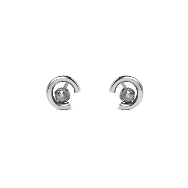 A pair of gold crescent-shaped stud earrings with round grey diamonds, shown on a plain white background.
