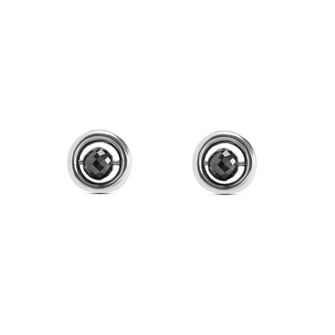 A pair of white gold stud earrings with a central faceted black diamond, set against a plain white background.