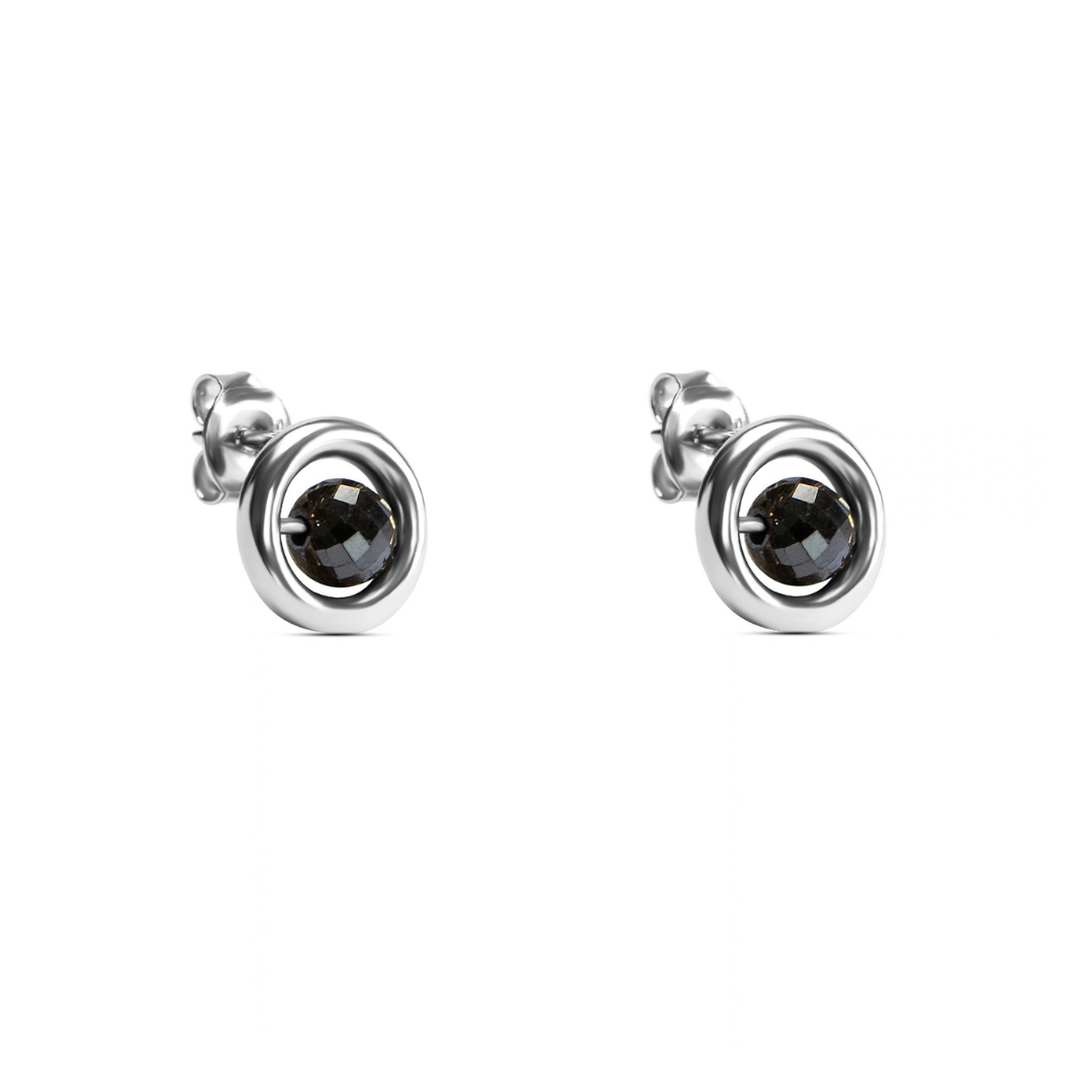 A pair of yellow gold stud earrings with a central faceted black diamond, set against a plain white background.