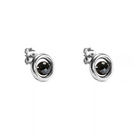 A pair of yellow gold stud earrings with a central faceted black diamond, set against a plain white background.