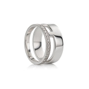 A swhite gold double-band ring with a central channel set with small clear stones, shown on a clean white background.
