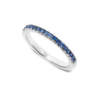 Silver ring with blue gemstones on a white background