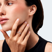 Woman wearing a 14k white gold ring set with 0.45 ct lab-grown diamonds, arranged in a striking zigzag silhouette.
