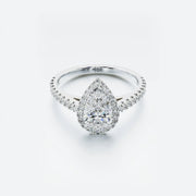 Diamond ring with a pear-shaped center stone on a white background