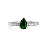 White gold ring with pear-shaper tourmaline and lined with pavé diamonds.