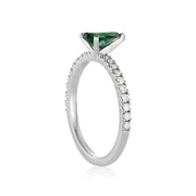 White gold ring with pear-shaper tourmaline and lined with pavé diamonds.