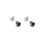 A pair of white gold stud earrings with faceted black diamonds, shown on a clean white background.