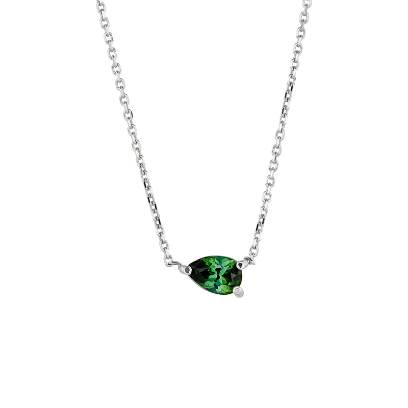 A minimalist and elegant pendant featuring a pear-cut tourmaline set sideways on a delicate white gold chain.