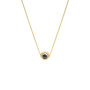 A delicate gold chain necklace featuring a small circular pendant with a gold outer ring and a dark, nearly black, faceted diamond, shown against a plain white background.