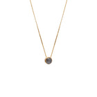 A delicate gold chain necklace with a small bezel-set rose-cut grey diamond pendant, shown against a plain white background.