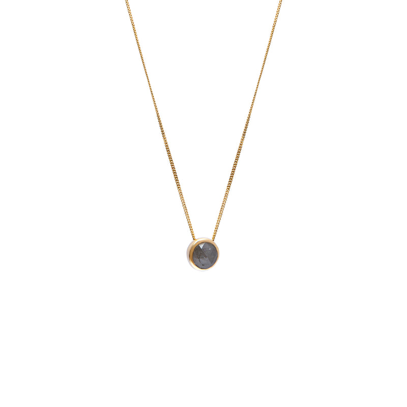 A delicate gold chain necklace with a small bezel-set rose-cut grey diamond pendant, shown against a plain white background.