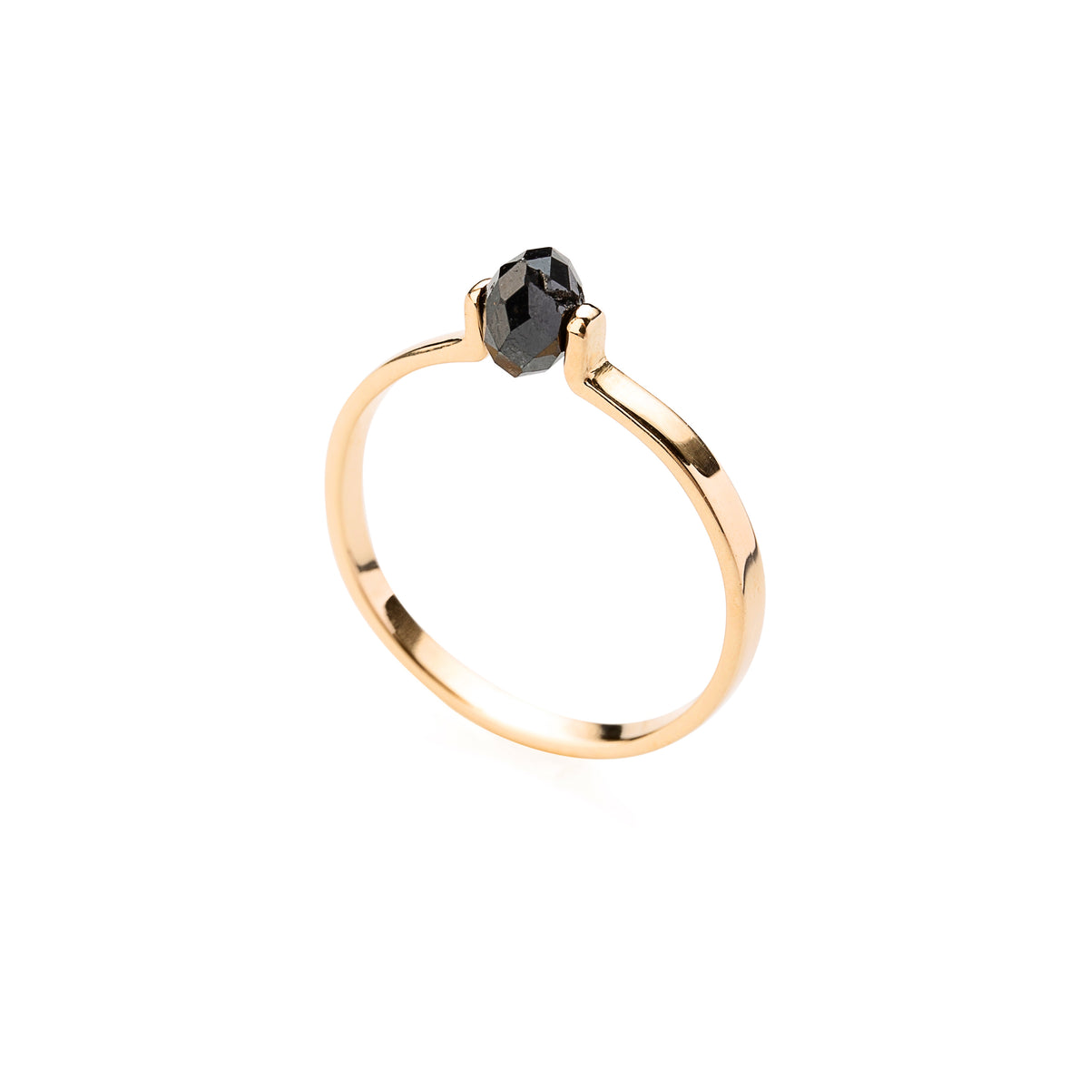 Gold ring with a black faceted diamond on a white background