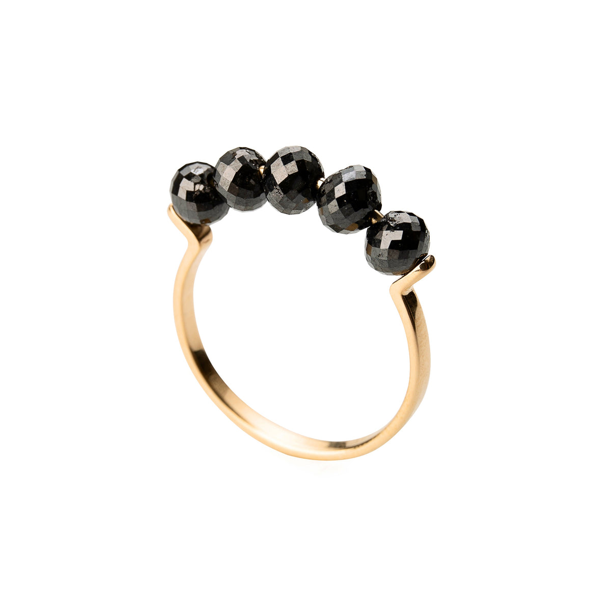 A yellow gold ring featuring five faceted black diamonds beads set across the top, photographed on a clean white background.
