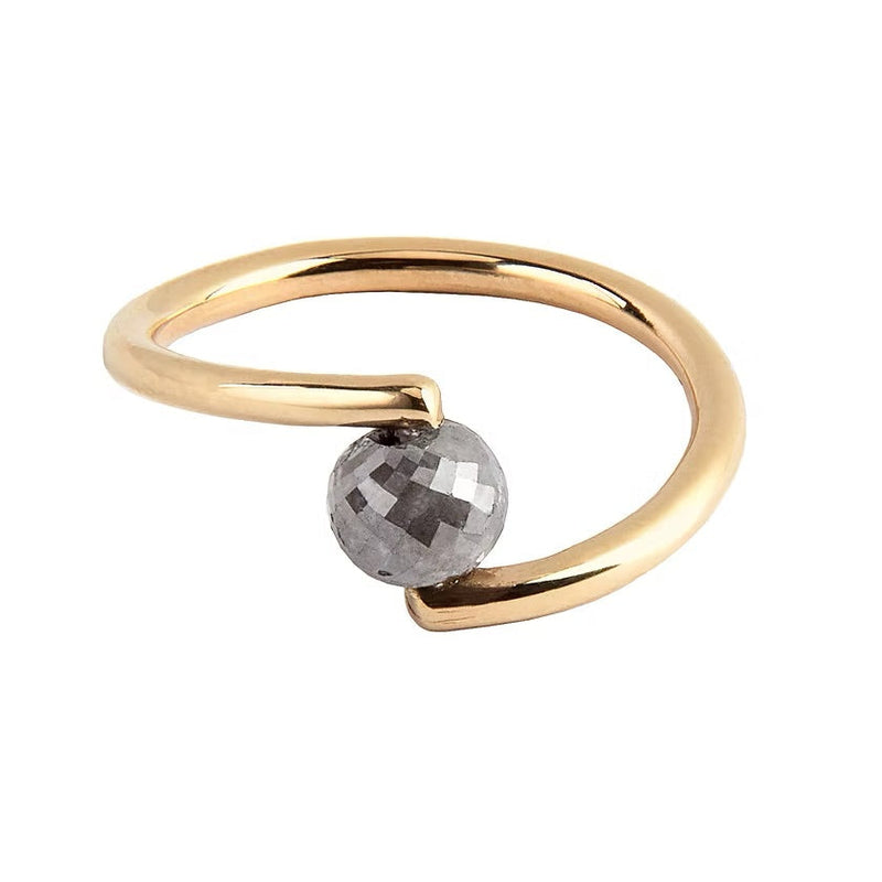 A yellow gold open wrap ring featuring a faceted grey diamond, shown on a plain white background.