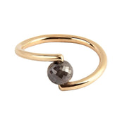 A yellow gold open wrap ring featuring a faceted black diamond, shown on a plain white background.