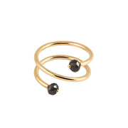 A yellow gold wrap ring featuring two faceted gray diamonds at the open ends, displayed on a clean white background.