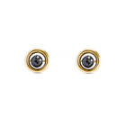 A pair of yellow gold stud earrings with a central faceted black diamond, set against a plain white background.