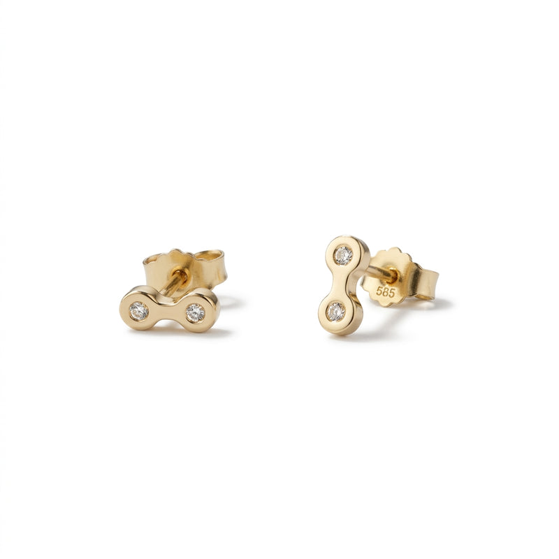 A pair of gold stud earrings with a small chain-link design, each set with a brilliant diamond, shown on a plain white background.