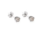 A pair of gold stud earrings with faceted gray diamonds in a prong setting, shown on a clean white background.