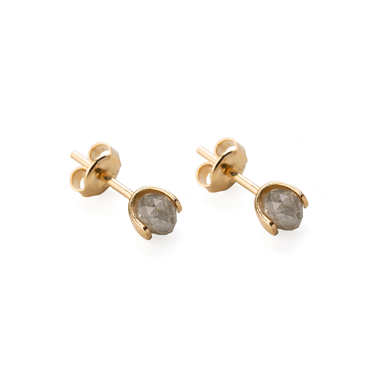 A pair of gold stud earrings with faceted gray diamonds in a prong setting, shown on a clean white background.