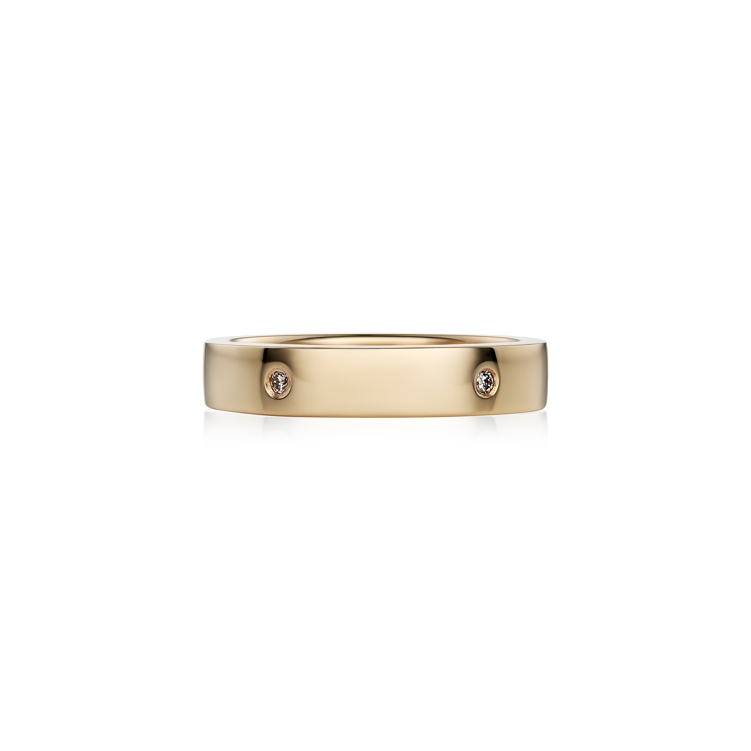 A slim yellow gold band ring with small brilliant diamonds set along it, photographed on a clean white background.