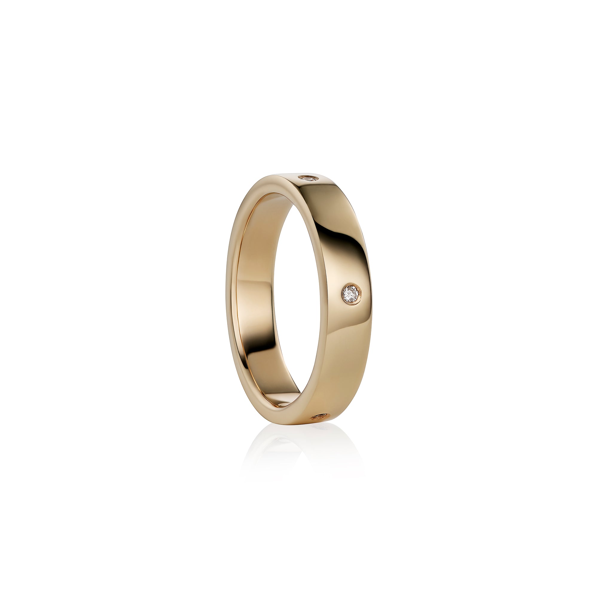 A polished yellow gold band ring with  small round-cut diamonds set on the side, shown against a clean white background with a soft reflection.