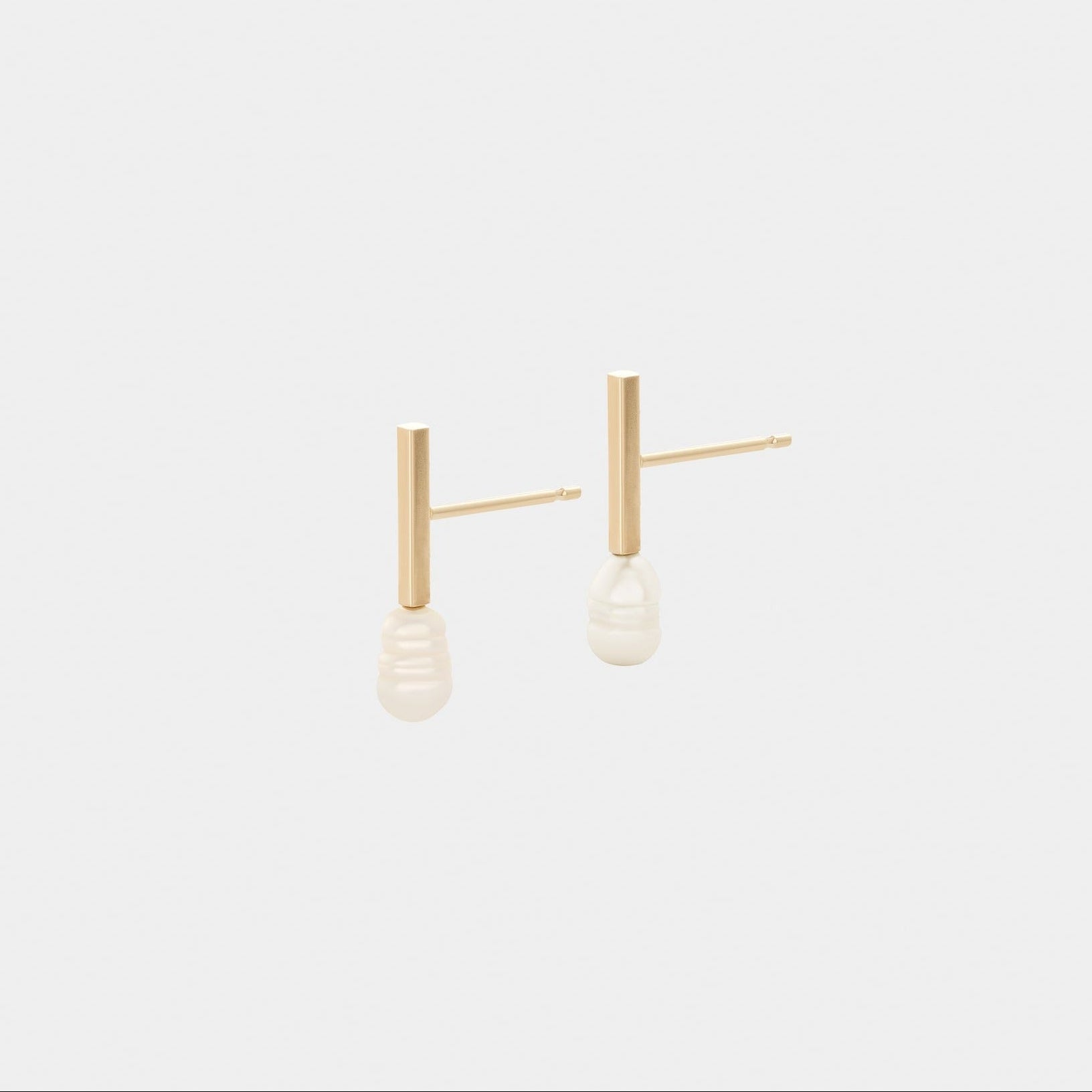 A pair of yellow gold earrings featuring freshwater pearls.