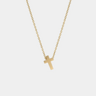 Yellow gold cross necklace on a white background