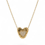 Gold heart-shaped necklace with embedded diamonds on a white background