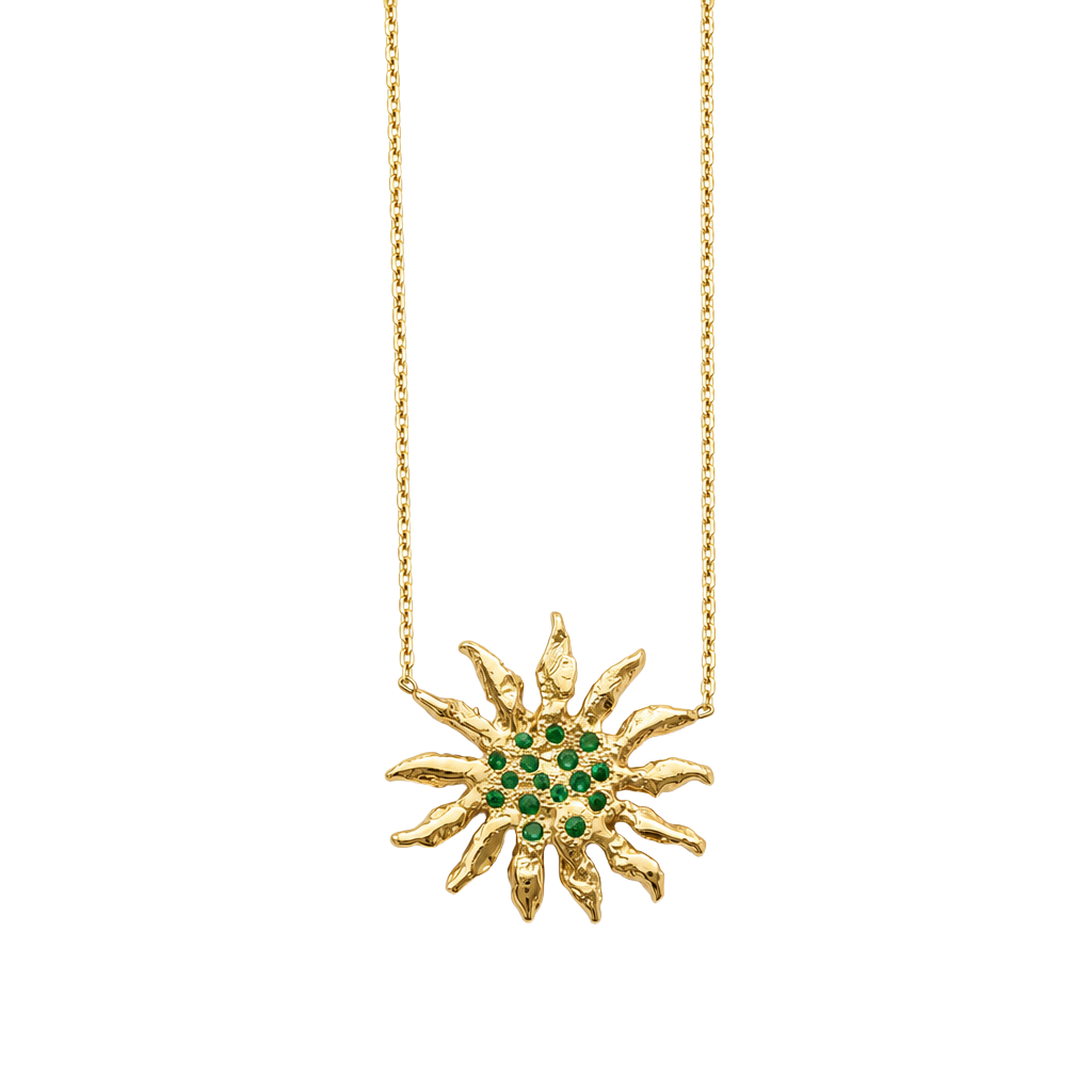 Gold necklace with a sunflower-shaped pendant featuring green emerald stones on a white background