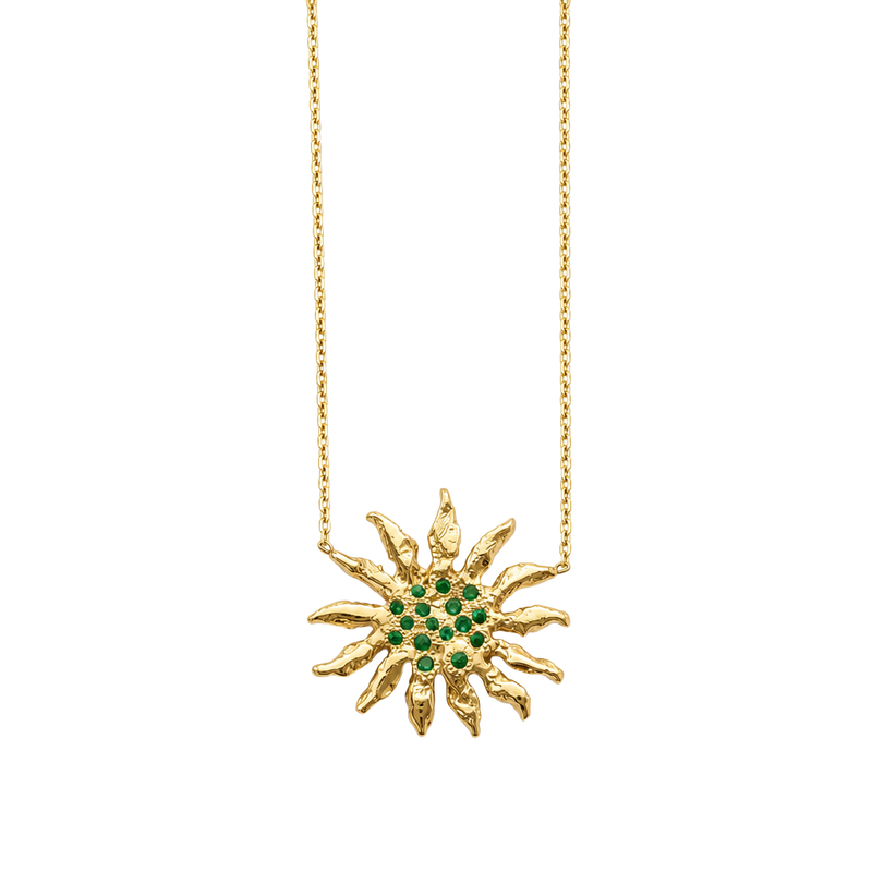 Gold necklace with a sunflower-shaped pendant featuring green emerald stones on a white background