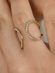 A yellow gold ring and ear cuff featuring a series of lab grown diamonds set in recycled 18k yellow gold, with a total of 86 diamonds.
