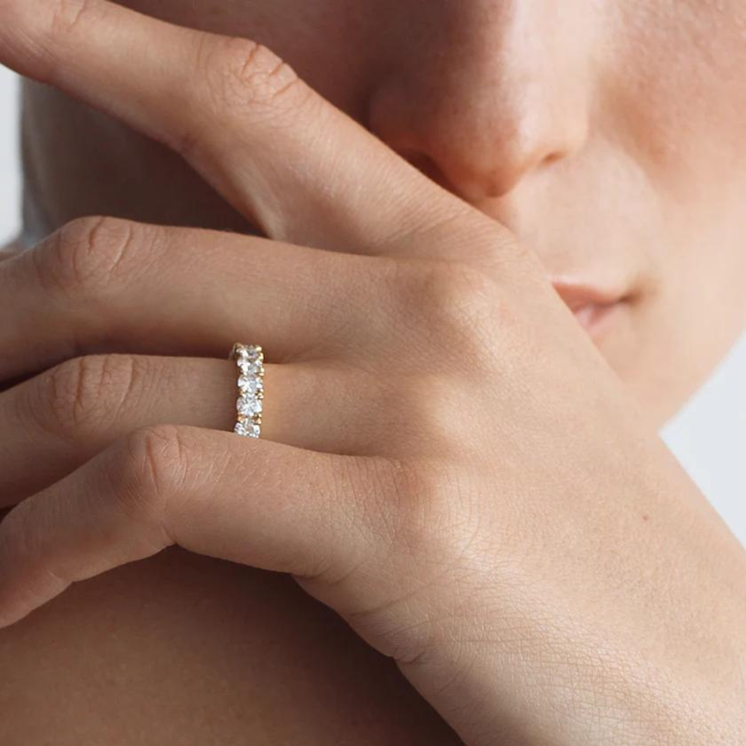 A yellow gold ring featuring a band of inset premium laboratory made diamonds, with a total weight of approximately 2.65 carats.
