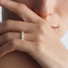 A yellow gold ring featuring a band of inset premium laboratory made diamonds, with a total weight of approximately 2.65 carats.