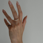 A yellow gold ring featuring a band of inset premium laboratory made diamonds, with a total weight of approximately 2.65 carats.