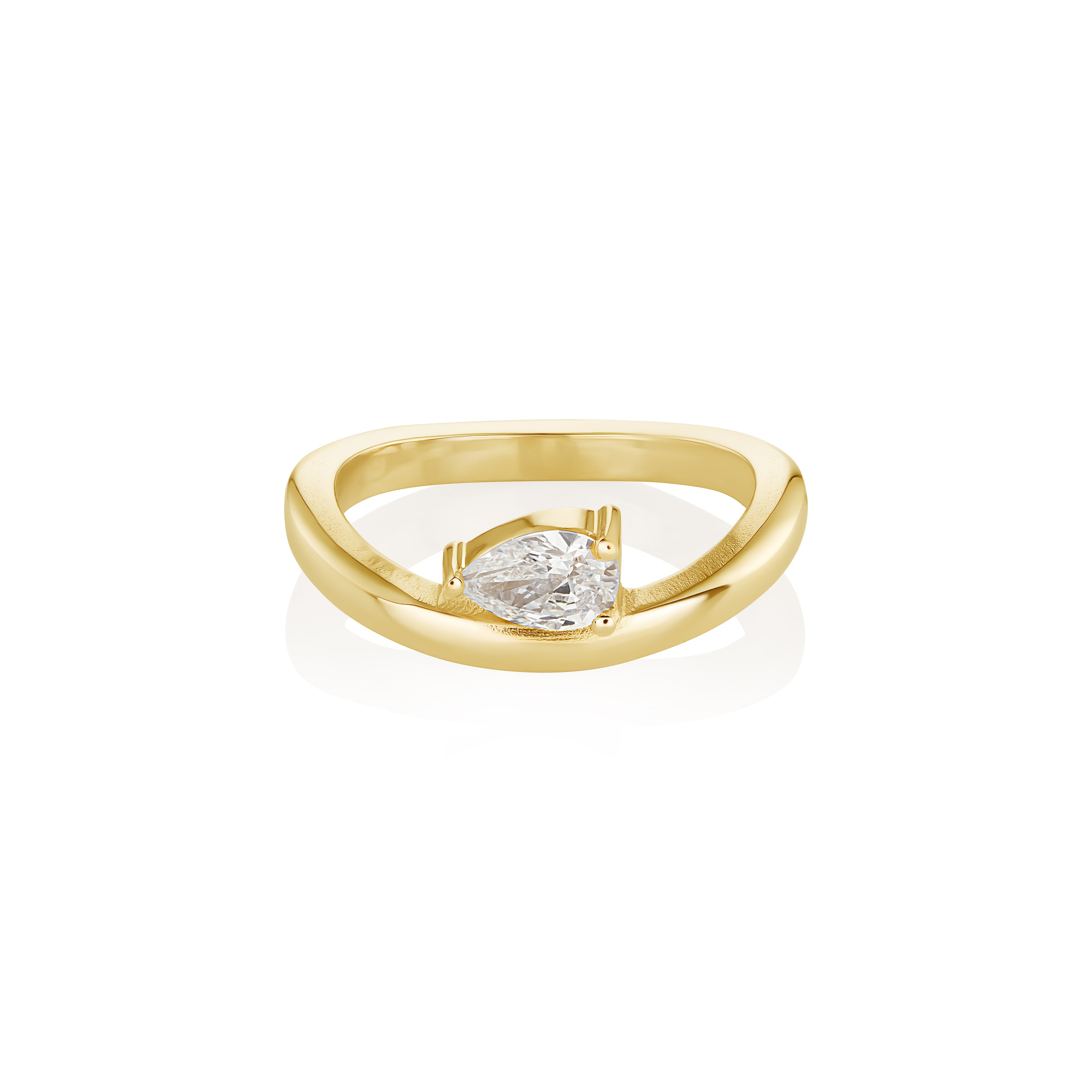 yellow gold ring with a pear-shaped diamond on a white background