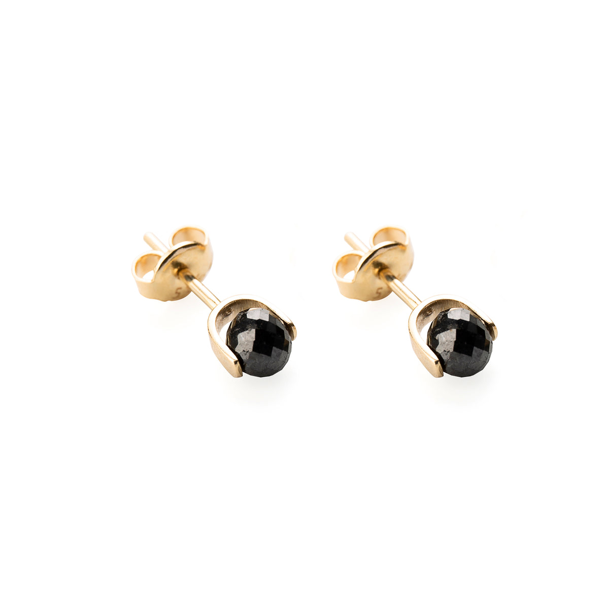 A pair of gold stud earrings with faceted black diamonds in a bezel setting, shown on a plain white background.