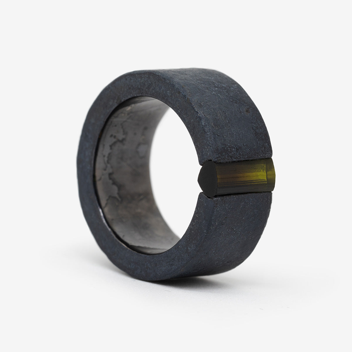 One-of-a-kind ring composed of niobium and green tourmaline by ASR JWLS.