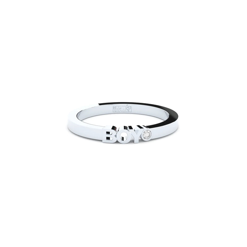 A solid white gold ring with the finest quality laboratory made diamond, featuring the inscription 'BOY' on it.